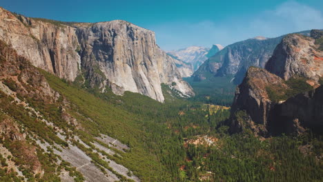 bright sunny day scenery in yosemite national park, california, usa. amazing cliff mountains with green forests at its foot. aerial view.