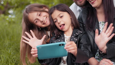 family taking a selfie in the park