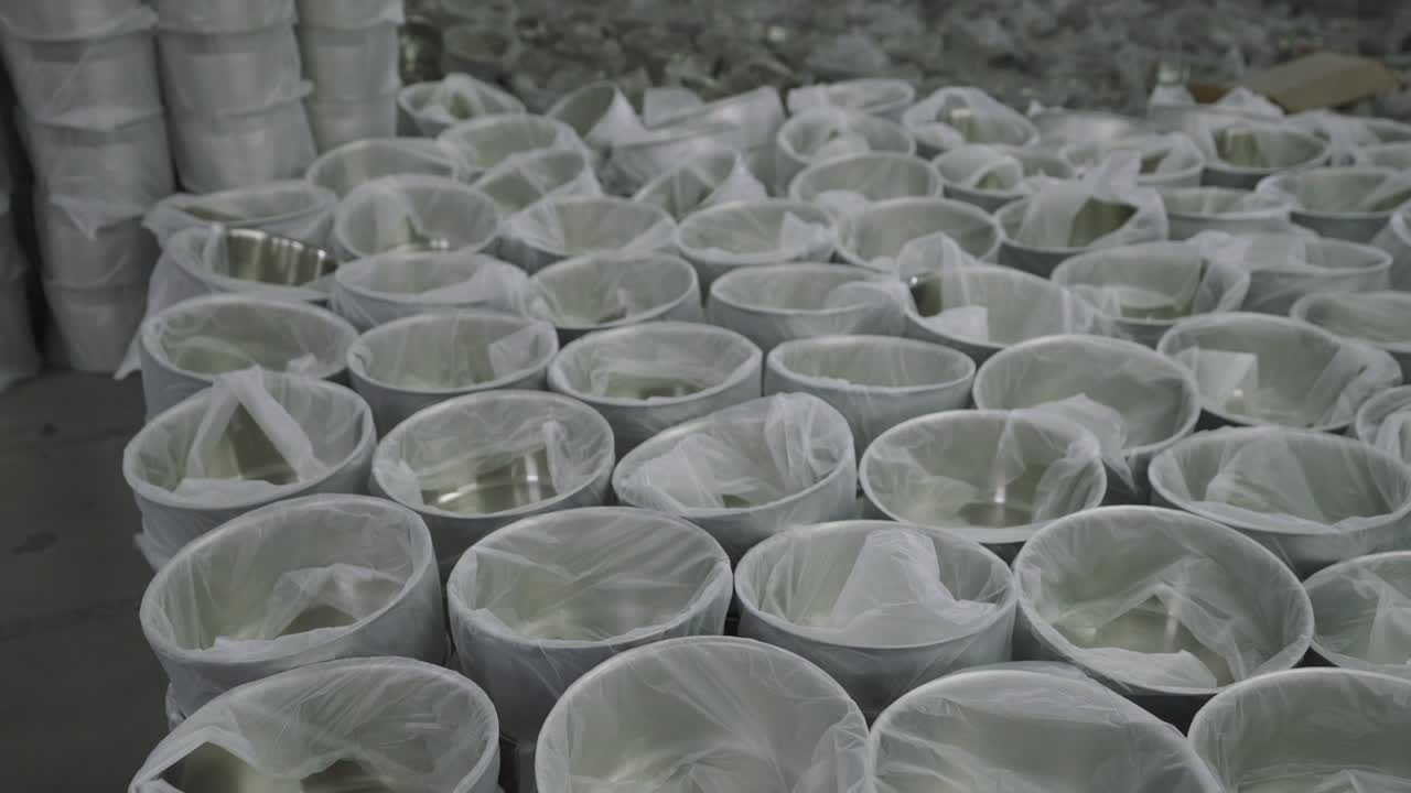 Cookware factory stacked with pans packed ready