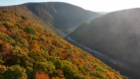 dramatic aerial flight among mountaintop in autumn