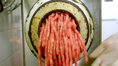 Minced-come-out-from-the-meat-mincer-machine-4k