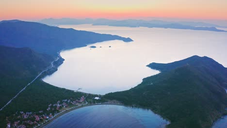 drone footage – small peninsula in mediterranean sea at sunrise dawn
