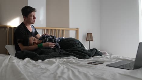 couple relaxing together in bed