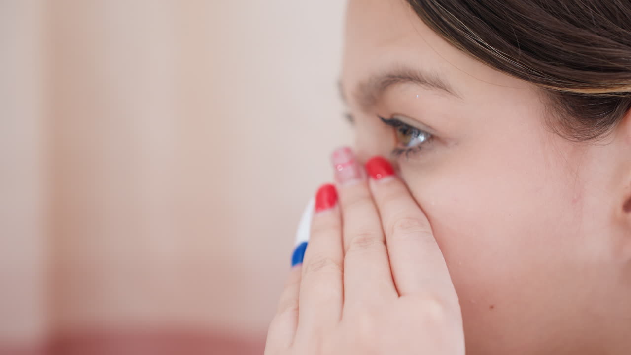 Model Applying Skincare, Closeup Of Skincare Routine, Detailed View Of Skincare Application On Facial Area, Intimate Moment Capturing Delicate Skin Care Procedure With Colorful Manicured Nails