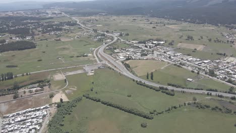 aerial view of flatlands in chile with acres of green pastures