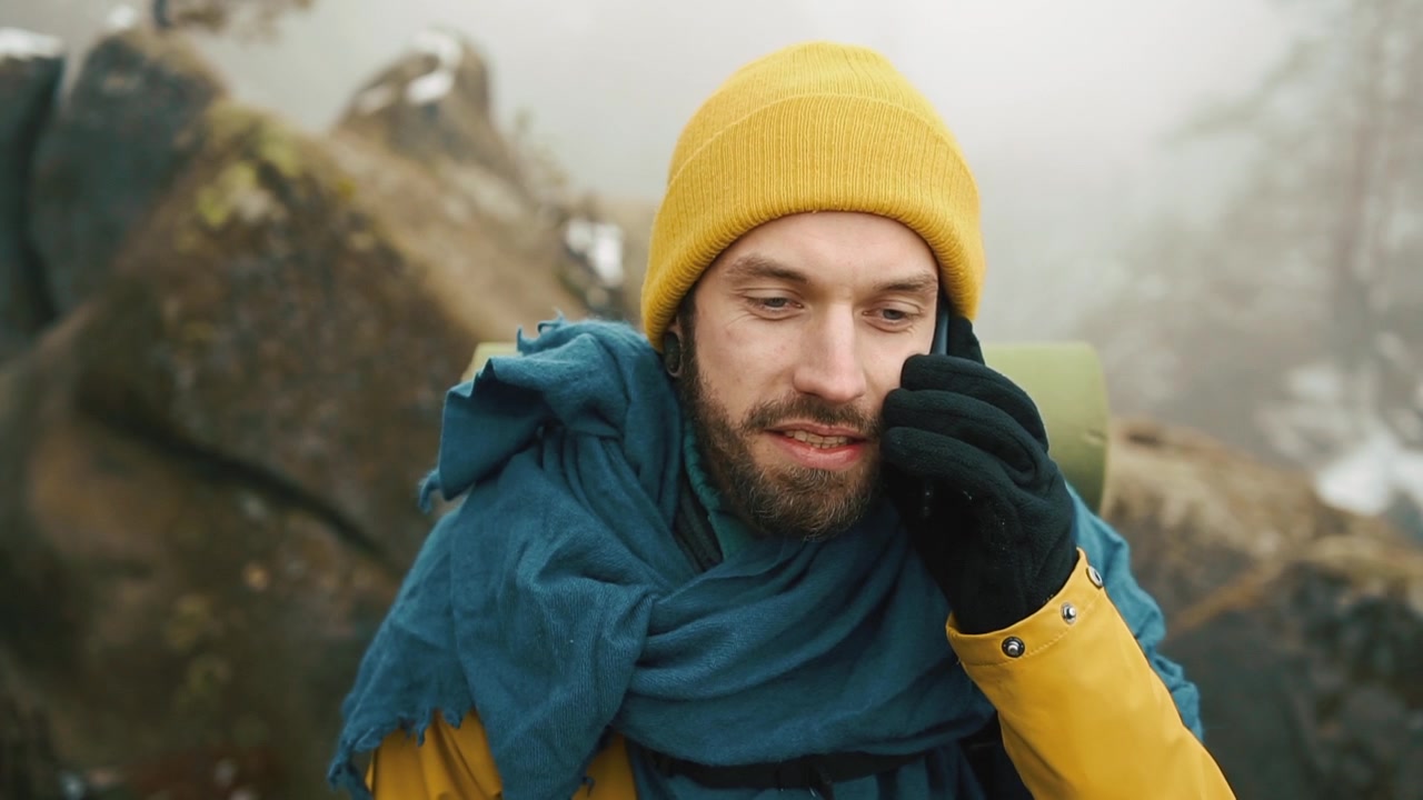 Man talking on cellphone outdoors