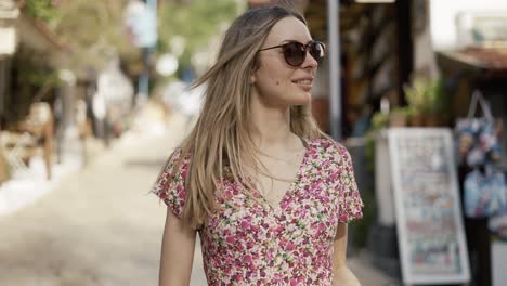 outdoor portrait happy female tourist having good time wandering around town in summer