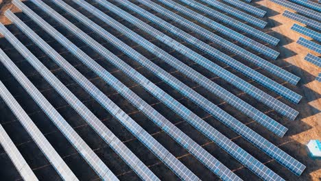 aerial view of rows of solar panels in a field. green energy landscape electrical power ecology innovation nature environment