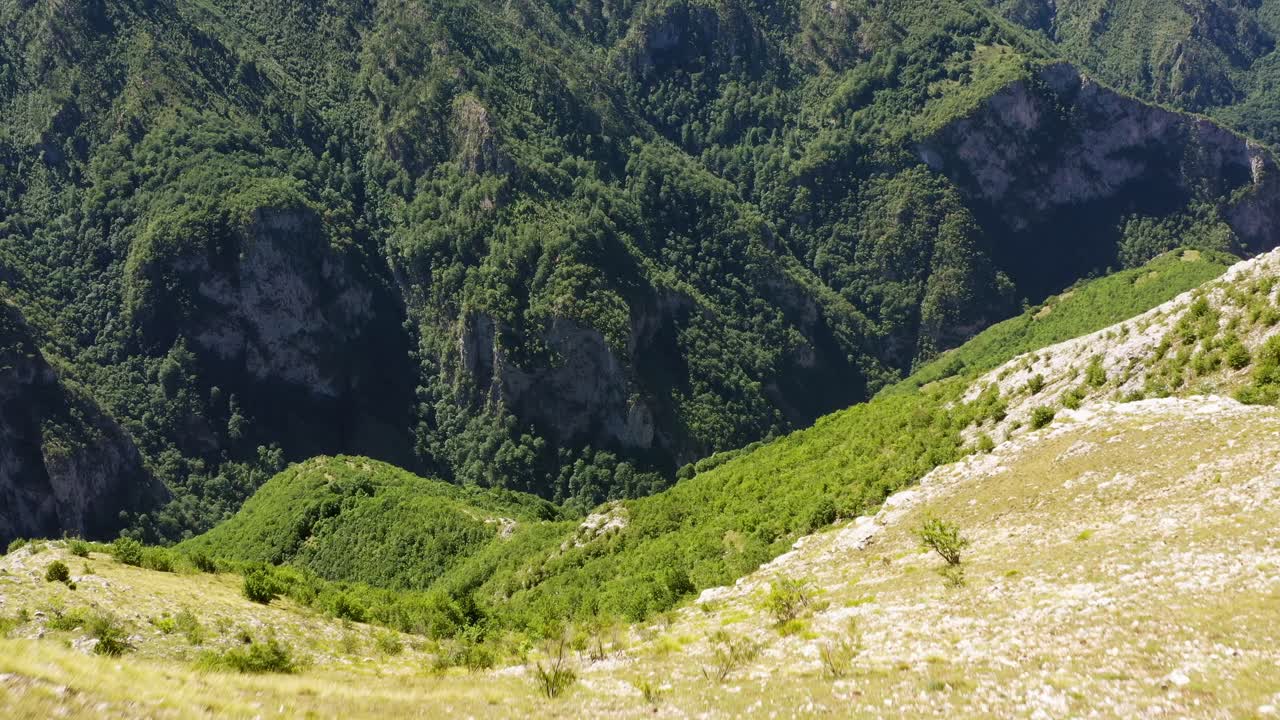 reveal of a mighty cliff, idyllic mountains in Bosnia. Aerial forward