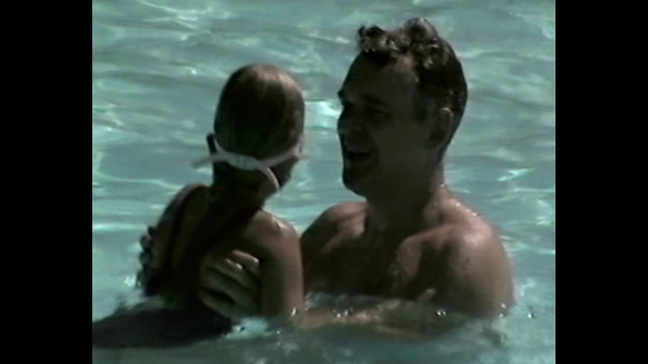 People enjoying swimming in a pool