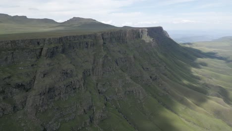 steep eroded cliffs tumble off the lesotho plateau into south africa