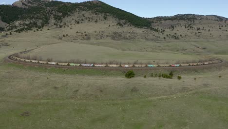 Aerial-Zoom-and-Pan-Train-on-Mountain