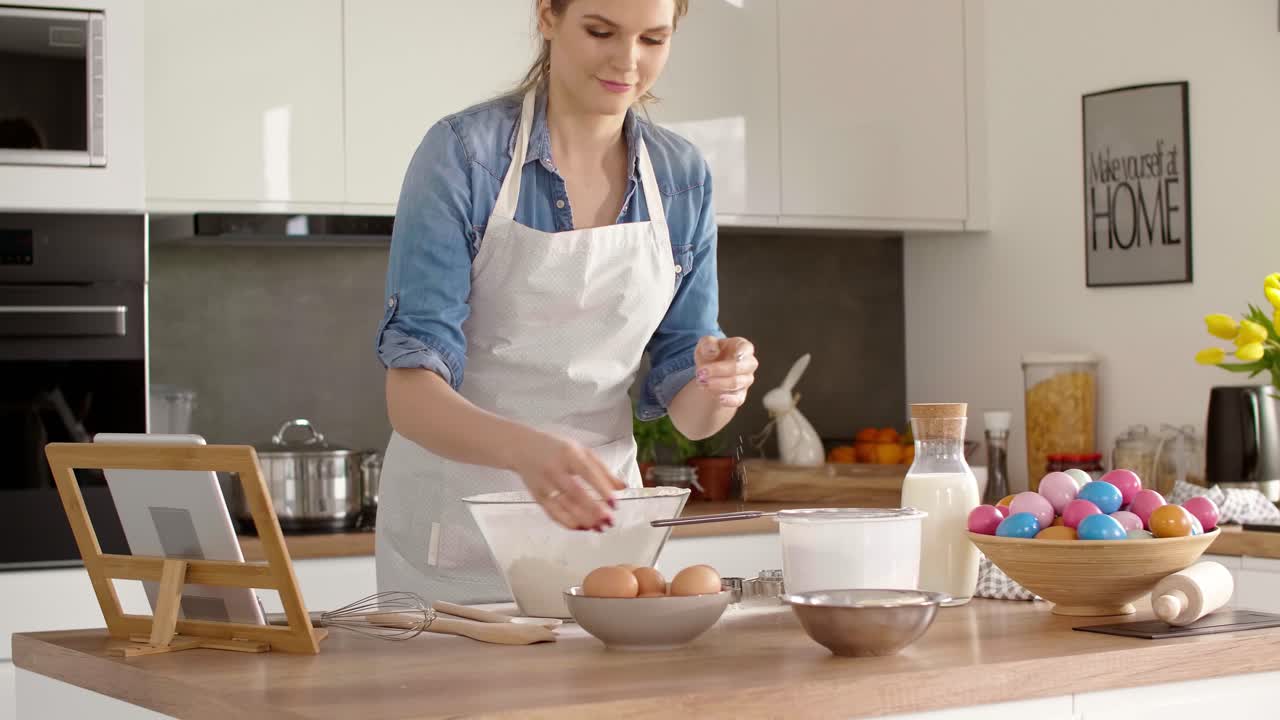 Young woman baking a cake for Easter