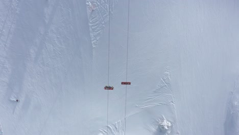 top view of people riding on ski lift at jahorina mountain ski resort during winter at bosnia and herzegovina