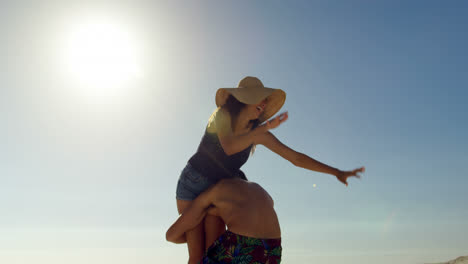 couple having fun on the beach 4k