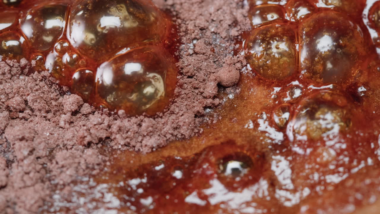 Close-up of Boiling Caramel with Cocoa Powder
