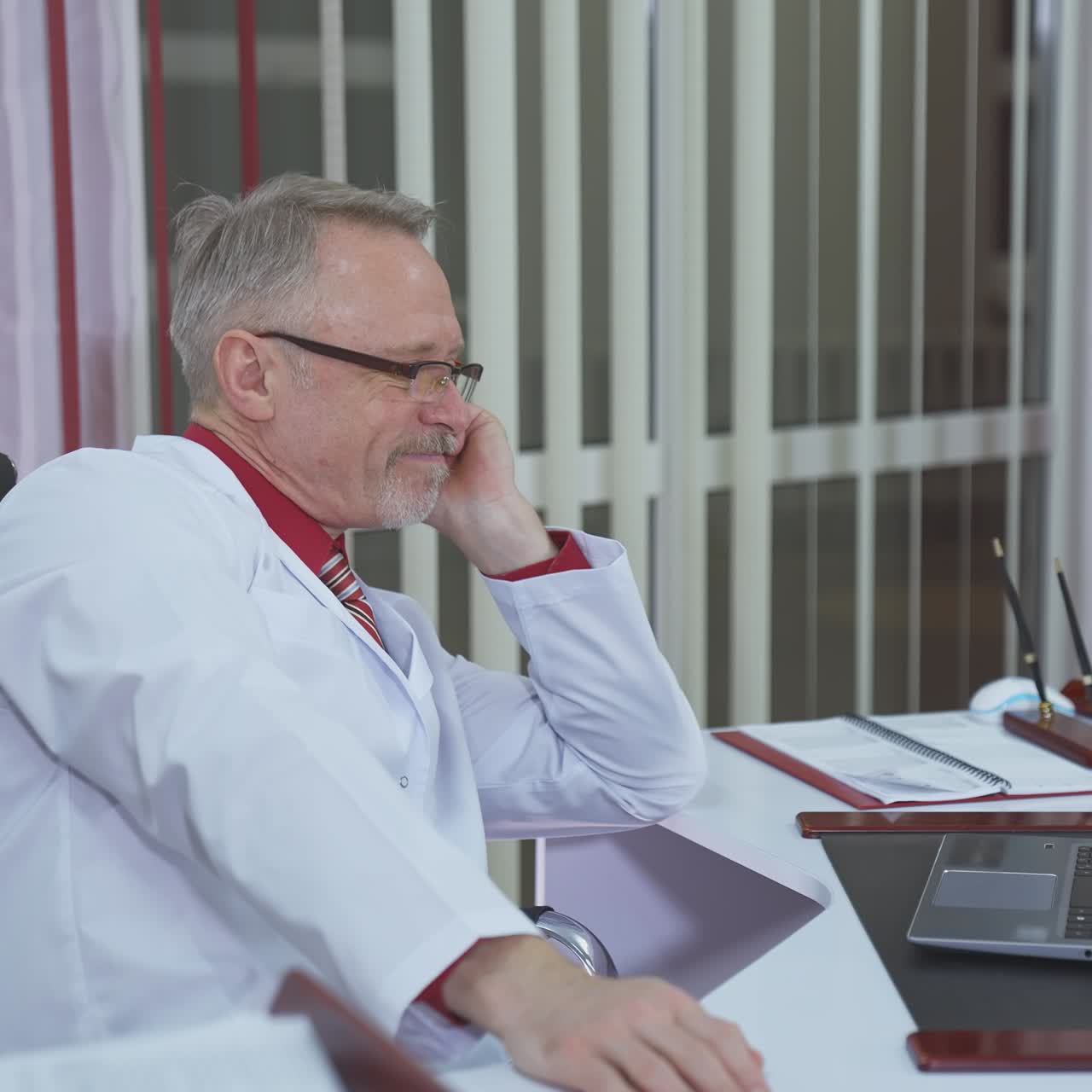 Overworked doctor sitting in his office