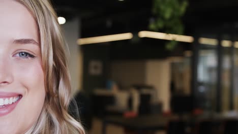 portrait of happy plus size caucasian businesswoman with blonde hair, copy space, slow motion