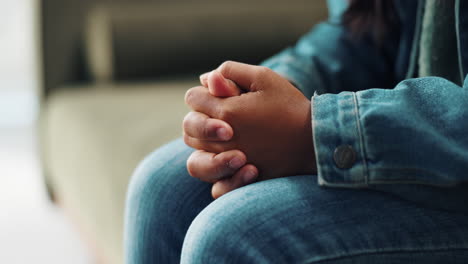 close up of hands clasped in denim