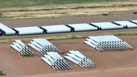 Wind-turbine-blades-and-parts-waiting-for-assembly-and-installation-on-wind-farm