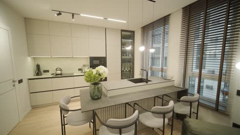 modern minimalist kitchen interior with large windows and neutral tones