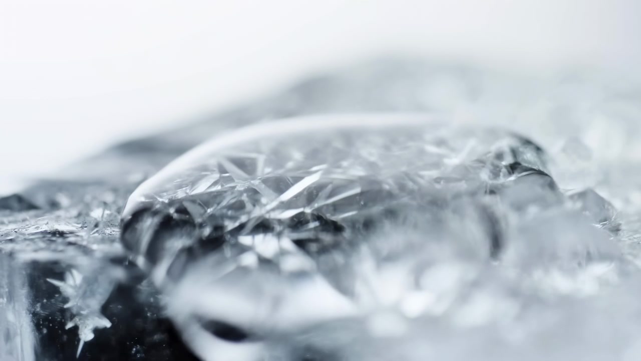 A frozen landscape observed in a calm and serene snowy environment with a close-up, low angle view of ice and snow in a cold, snowy setting during winter, featuring white and gray tones.