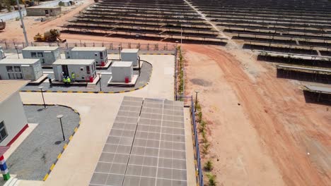 completed construction and installation of solar pv power plant facilities with battery energy storage system (bess), solar car shed and numerous solar arrays - aerial panorama view