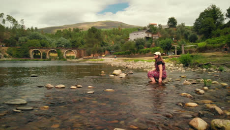 girl in the river in a summer day