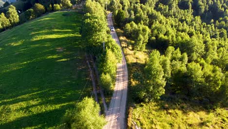 a car passing by on a mountain road