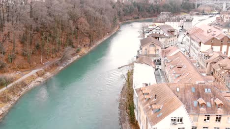 Fly-over-Aare-River,-aerial-view-of-Bern-Old-City
