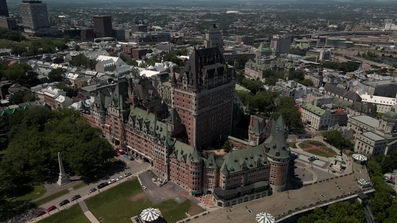 Slow aerial circle pan of luxurious Hotel Chateau Frontenac at high angle