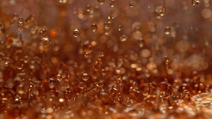 Fizzy Soda Splashes And Creates Standing Waves, Abstract Brown Liquid In Macro and Slow Motion