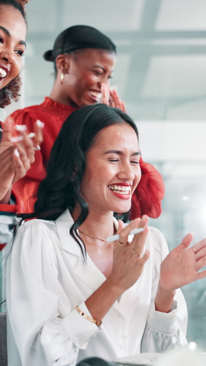 Happy Businesswomen Clapping and Celebrating Success in an Office