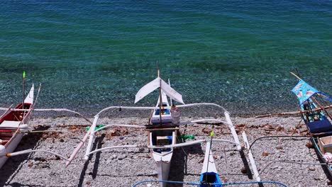 drone shot of fishing boats at mabua beach in surigao philippines