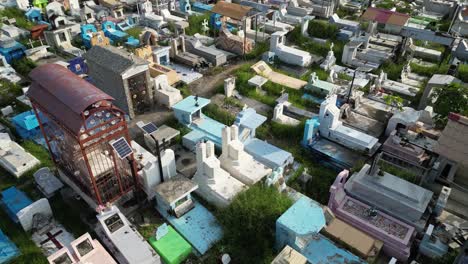 aerial view of colorful graves and memorials at santa cruz cemetery in dili