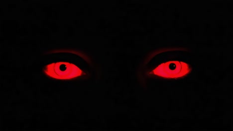 an intense stare: captivating red eyes emerge from darkness, creating a mysterious and ominous atmosphere that draws the viewer in