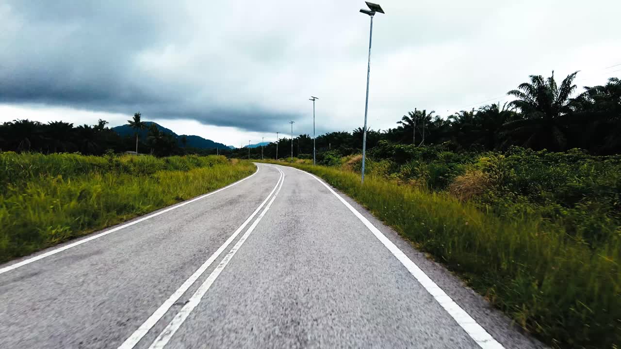 Beautiful View Drive Along Sempadi Lundu Coastal Road with Green Forest and Mountain,Sarawak,Borneo.