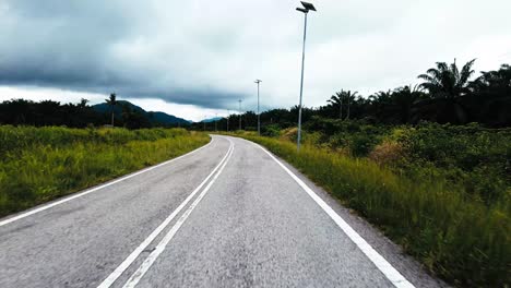 beautiful view drive along sempadi lundu coastal road with green forest and mountain,sarawak,borneo.