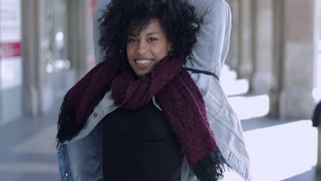 happy young woman posing with hands up