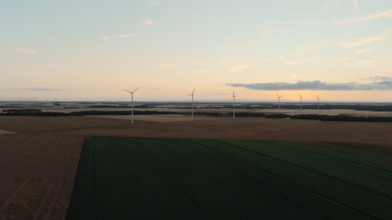 Wind Farm over Agricultural Fields at Sunset