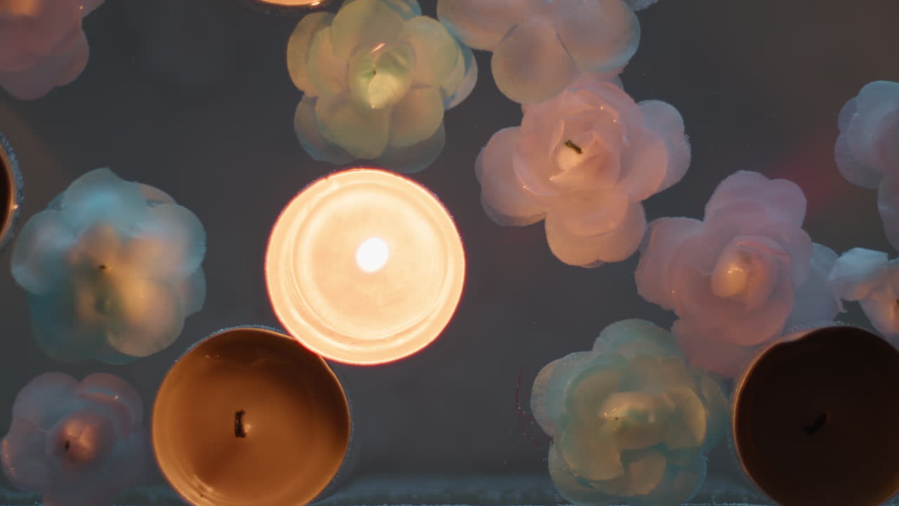 Lighting candle in water for the Indian festival of Diwali