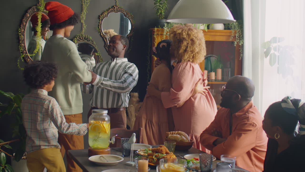 Happy African American Family Gathering for Home Dinner