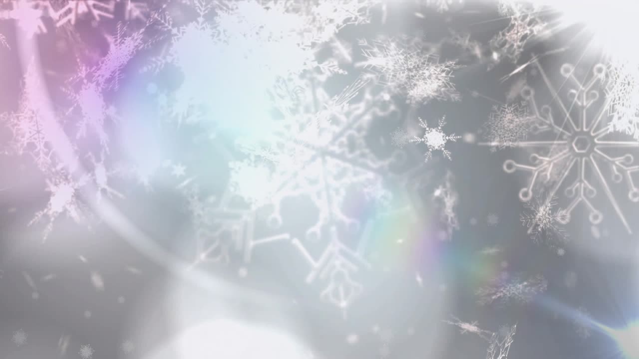 スターバーストのフレアが点滅し、灰色のボケの上に白い雪片が舞い降りる冬を彷彿とさせます。