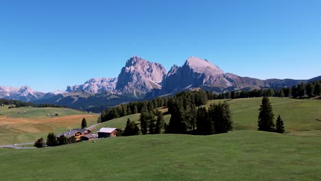 girl standing in front of high rock mountains