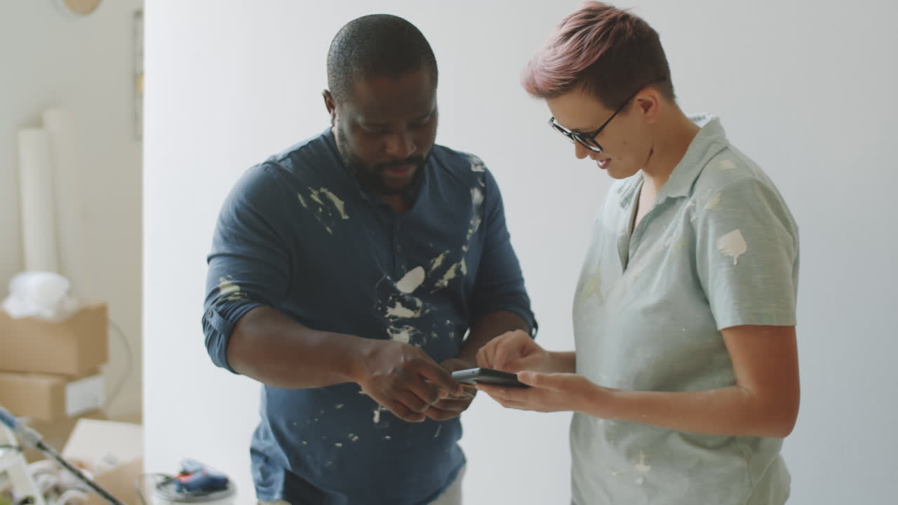 Couple Choosing Paint Color for Home Renovation