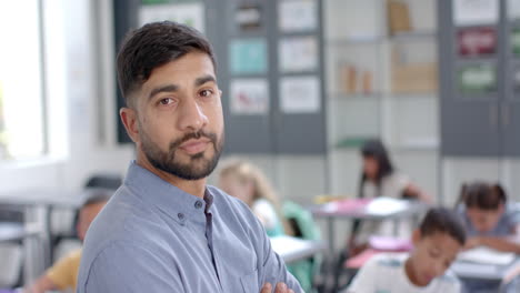 young asian man stands confidently in a classroom at school, with copy space