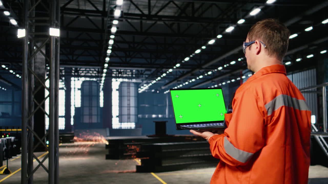 Mockup screen laptop with supervisor oversees construction and production tasks