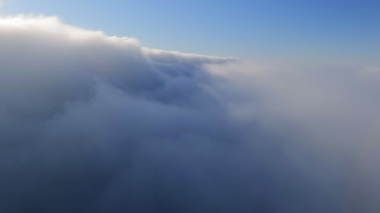 Flight Through Thick Cloudscape On A Foggy Morning Sky