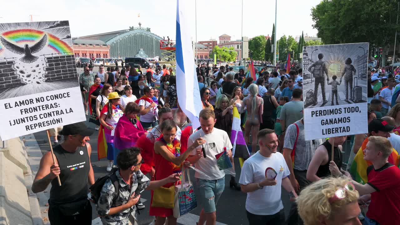 People participate in the LGBTQIA Pride Month parade in downtown Madrid to defend against injustices and discrimination targeting the LGBTI community.