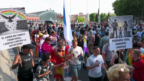 people participate in the lgbtqia pride month parade in downtown madrid to defend against injustices and discrimination targeting the lgbti community.